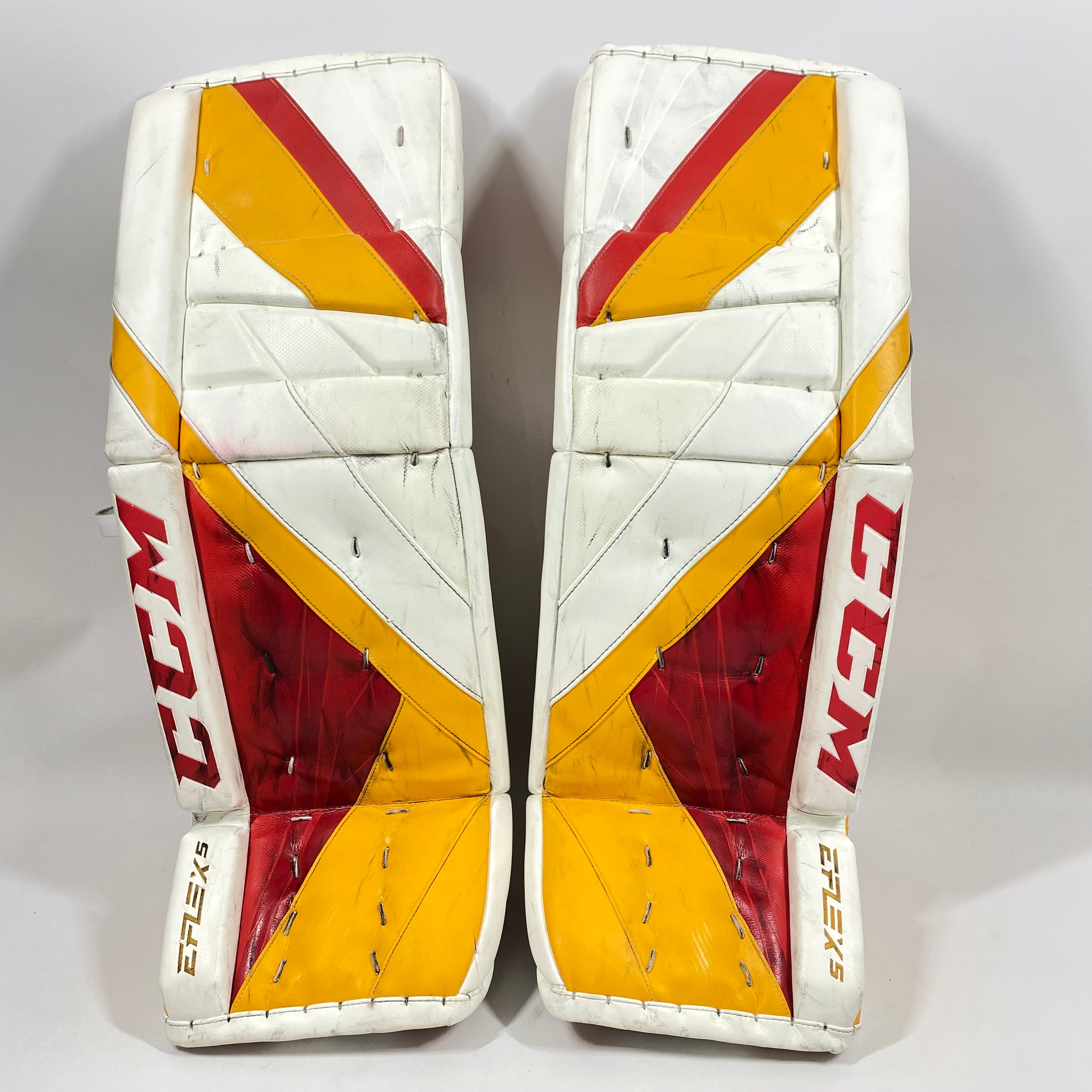 CCM Extreme Flex 5 - Jambières de gardien de but AHL Pro Stock d'occasion (blanc/rouge/jaune)